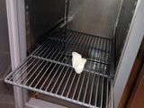 an open oven with a bag of food inside of it