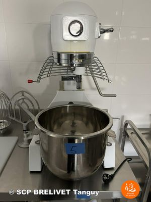a mixer that is sitting on a counter in a kitchen