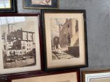many pictures hanging on the wall of a room