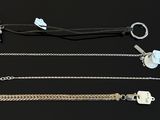 four different types of bracelets on a black surface