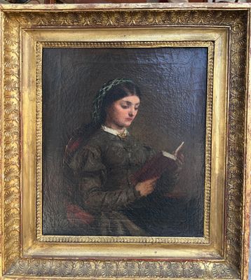tableau représentant une femme en train de lire un livre, dans un cadre doré