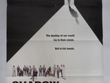 the poster for the movie shadow makers is hanging on the wall