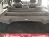 the back of a car with the seats folded down and the back seats folded down
