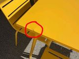 a yellow table with a red circle on it