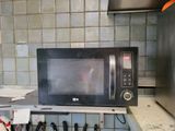 a microwave that is sitting on a counter in a kitchen
