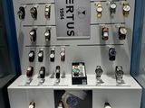 a lot of watches on display in a glass case