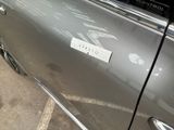 a sticker on the door of a car that says studio