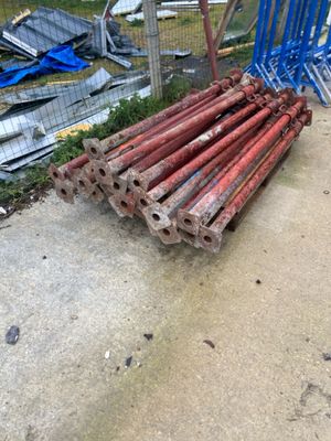 a pile of old rusty pipes on the ground