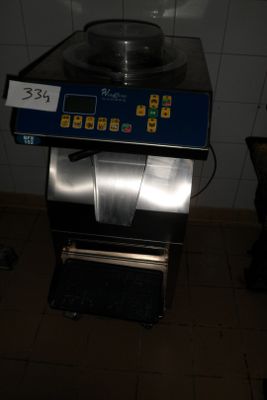 a microwave that is sitting on a counter in a bathroom