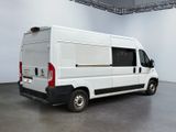 a white van that is parked in a large room