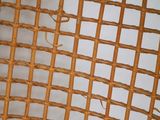 an image of a close up of a wicker chair