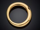 a gold ring with diamonds on a black background