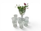 a glass vase with a flower in it on a table