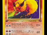 une photo d'une carte Pokémon représentant un Pokémon jaune et rouge