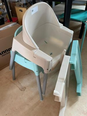 a baby seat that is sitting on top of a chair