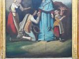 a man that is standing in front of a painting