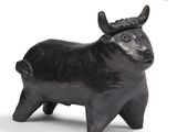 sculpture of a bull with horns on a white background