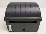 an image of a receipt printer sitting on top of a table