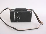 a small black camera with a strap on it