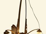 a chandelier with three lights hanging from it