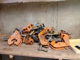a pile of tools sitting on a table in a room