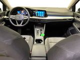 the interior of a car with a steering wheel and dashboard controls