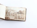 an open book with a picture of a castle on it