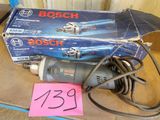a box of bosch tools on a table with a pink sticker