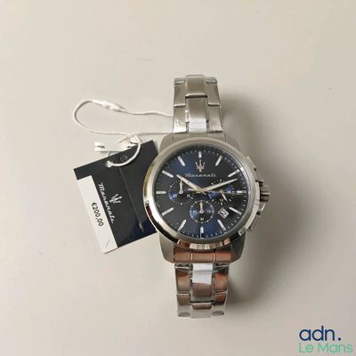 a picture of a watch with a tag attached to it