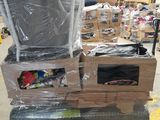 a stack of boxes and a television sitting on a pallet in a warehouse
