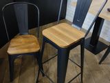 two chairs and a table in the corner of a room