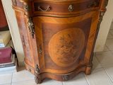 a vase that is sitting on top of a cabinet