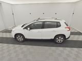 a picture of a white car parked in a garage