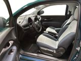 the interior of a car with the door open and the driver ' s seat up