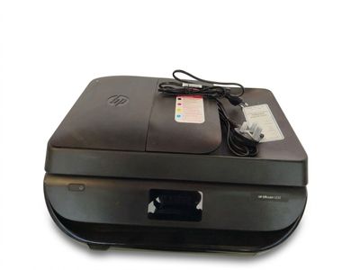 a black printer sitting on top of a white table