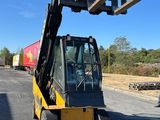 a forklift that is parked on the side of the road
