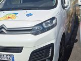a white van that is parked on the side of the road