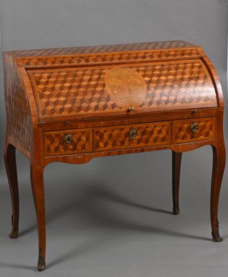 an antique writing desk with a checkered design on the top