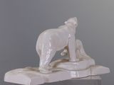 a statue of a polar bear standing on a rock