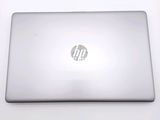 a white laptop with a hp logo on the screen