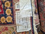 a close up of a rug with a tag on it