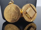 gold plated cuff watch with engraved initials on the back of it