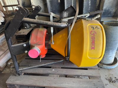 a yellow container sitting on a pallet next to a yellow can