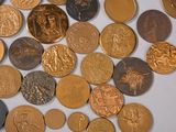 a lot of coins that are on a table