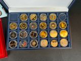 a lot of coins in a box on the table