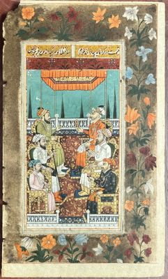 un vieux livre sur lequel figure l'image d'un homme et d'une femme assis sur un canapé