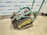 a close up of a machine that is sitting on the ground