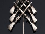 a close up of a metal object with a bunch of guns on it