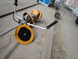 a small machine that is sitting on the side of the road