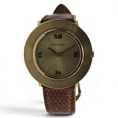 an image of a close up of a wrist watch with roman numerals